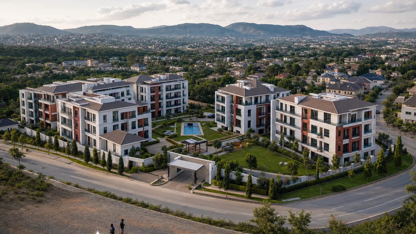 Illustrative aerial overview of a landscaped Abuja residential development and its surrounding roads